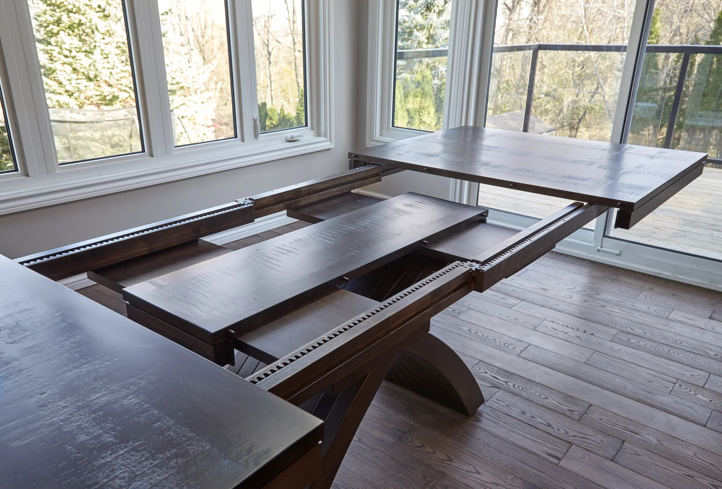 Custom solid wood extension dining table handcrafted for an Ontario home